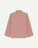Back view of dusty pink, buttoned organic cotton overshirt with view of reinforced elbow area and boxy silhouette.