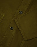 Close-up of a green corduroy shirt-jacket showing the plant-based Corozo buttons
