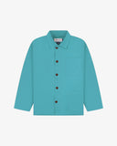 Front flat shot of turquoise blue Uskees overshirt with brown buttons on a light gray background