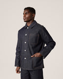 Three-quarter model shot of Uskees raw orta denim shirt-jacket