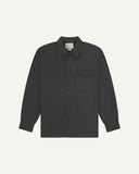 Charcoal buttoned organic cotton overshirt from Uskees with clear view of chest pocket and Uskees branding label.