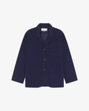 Flat front shot of Uskees dark blue corduroy men's jacket with button details on a white background