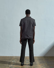 Full-length rear view of #3029, charcoal-coloured organic canvas vest.