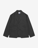Full front view of organic cotton twill charcoal-grey docklands blazer from Uskees. Clearly showing 2-button fastening, 3 jetted pockets and Uskees brand labels.