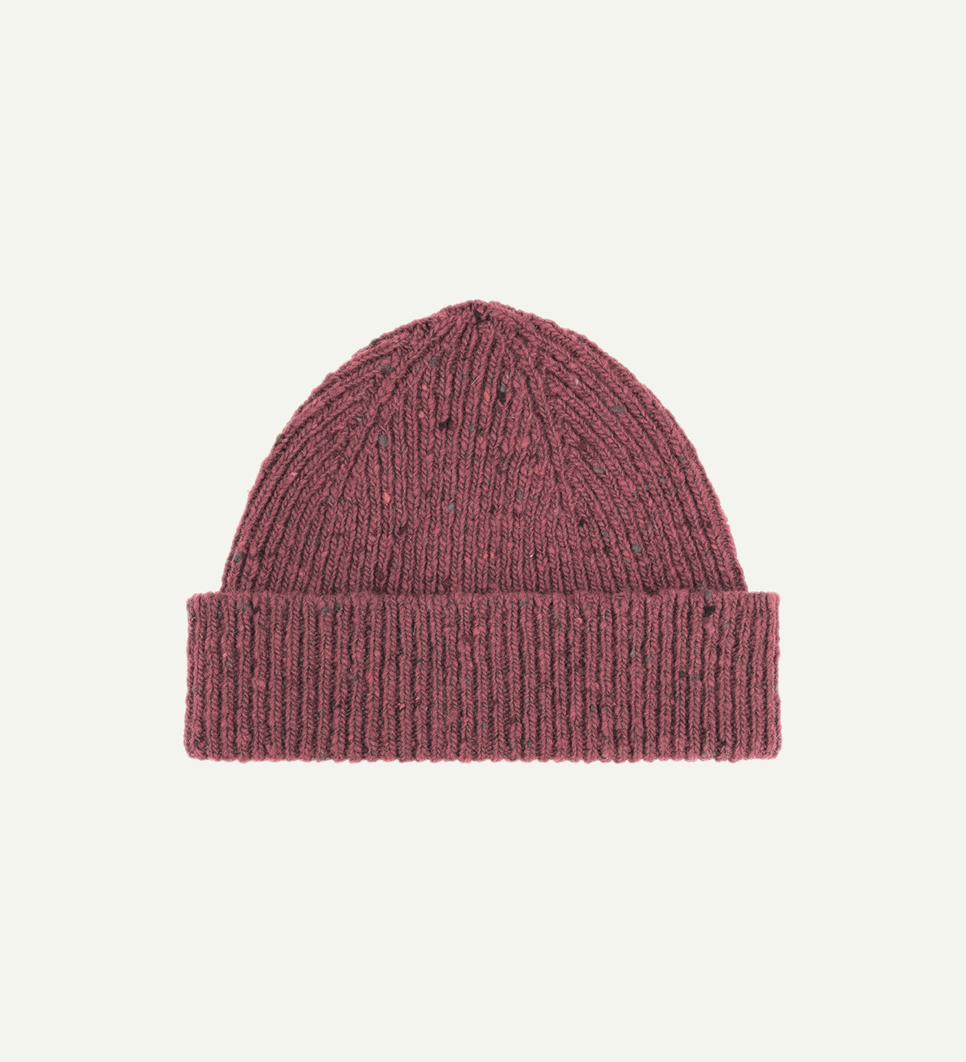  Flat view of Uskees 4003 donegal wool hat in 'dusty pink' . There is a clear view of the adjustable cuff and the 'speckled' nature of the hat.