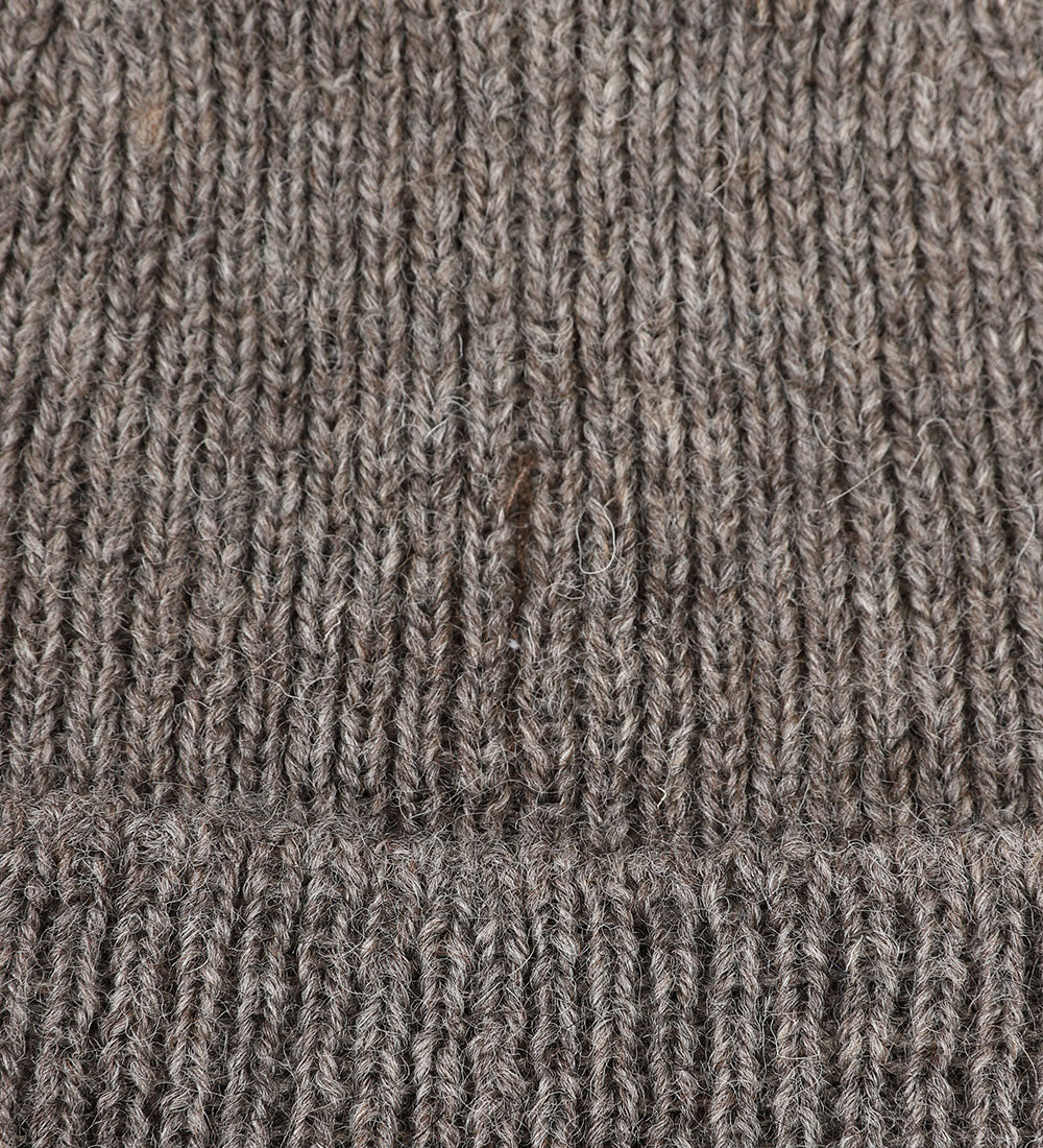 Close-up view of Uskees 4005 'rye' greyish coloured wool hat, showing the texture of the Bluefaced Leicester and Masham wool blend.