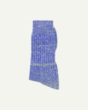Folded shot of Uskees 4006 organic cotton socks in ultra blue, showing random parallel knitting pattern.