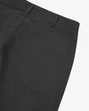 Close-up reverse view of Uskees charcoal twill pants with focus on left rear patch pocket and belt loops.