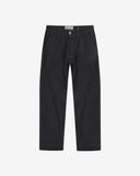 Full-length front view of raw orta denim workwear pants in dark indigo. Showing button fastening, zip, Uskees branding label and tapered leg fit.
