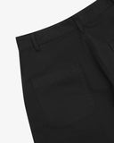 Close up back view of Uskees black twill painter trousers for men showing the waistband, belt loops and back pocket presented on a white background