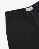 Close up view of Uskees black twill painter trousers for men showing the waistband, belt loops and pocket presented on a white background