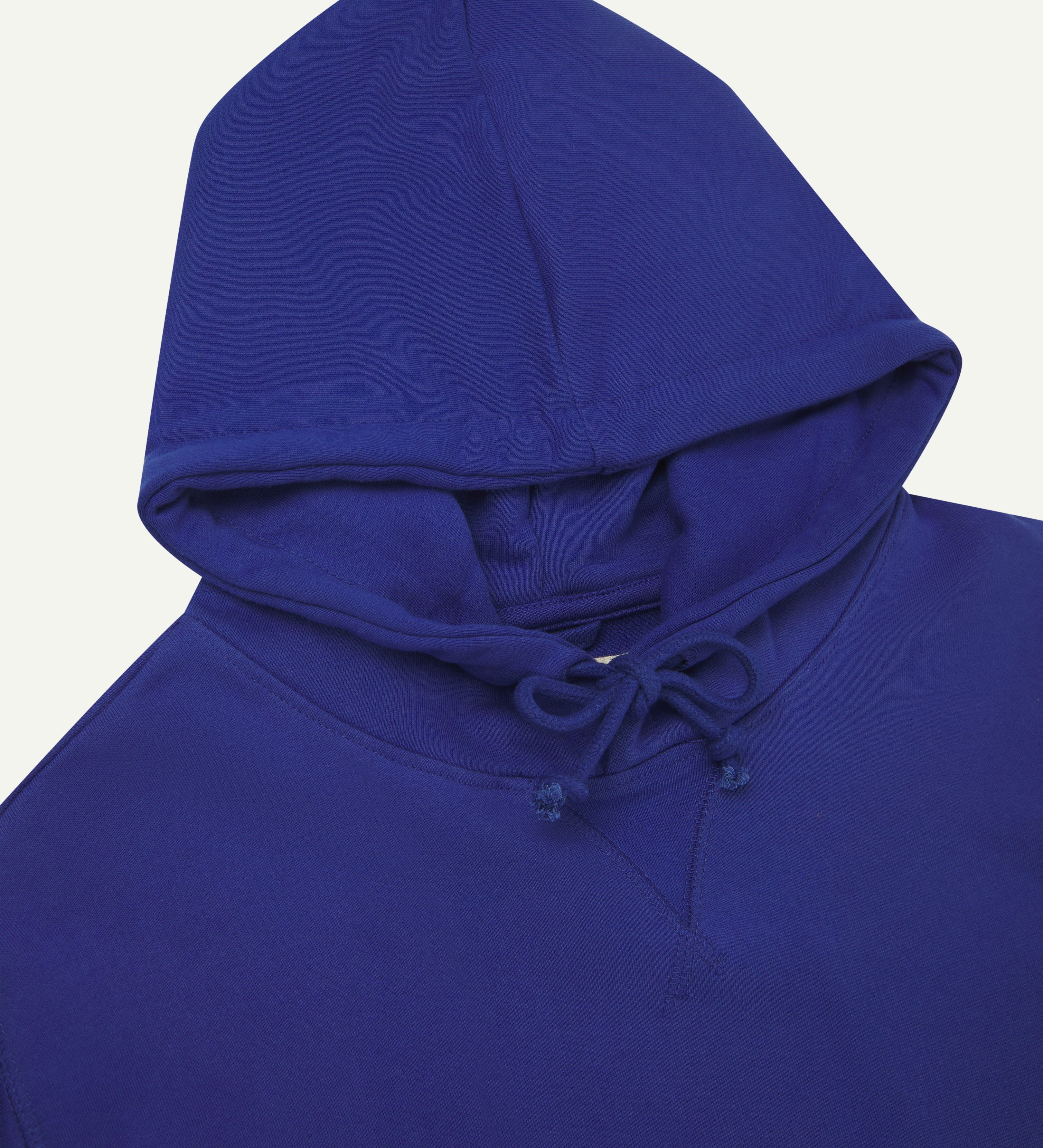 Front view of vivid ultra blue organic heavyweight cotton #7004 jersey hooded sweatshirt by Uskees showing hood tie detail