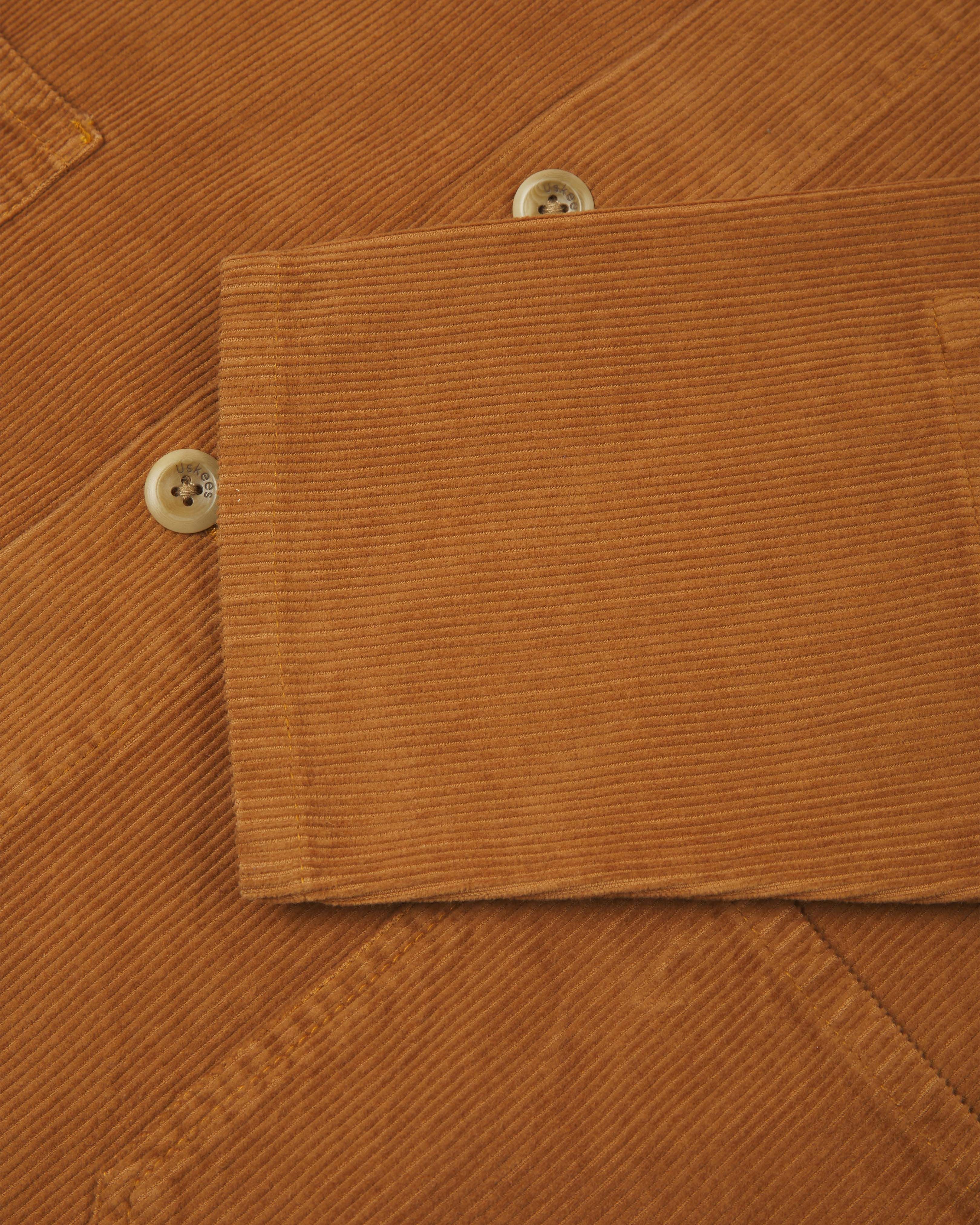 Close up shot of Uskees tan corduroy #3001 over-shirt clearly showing corozo buttons and sleeve detail