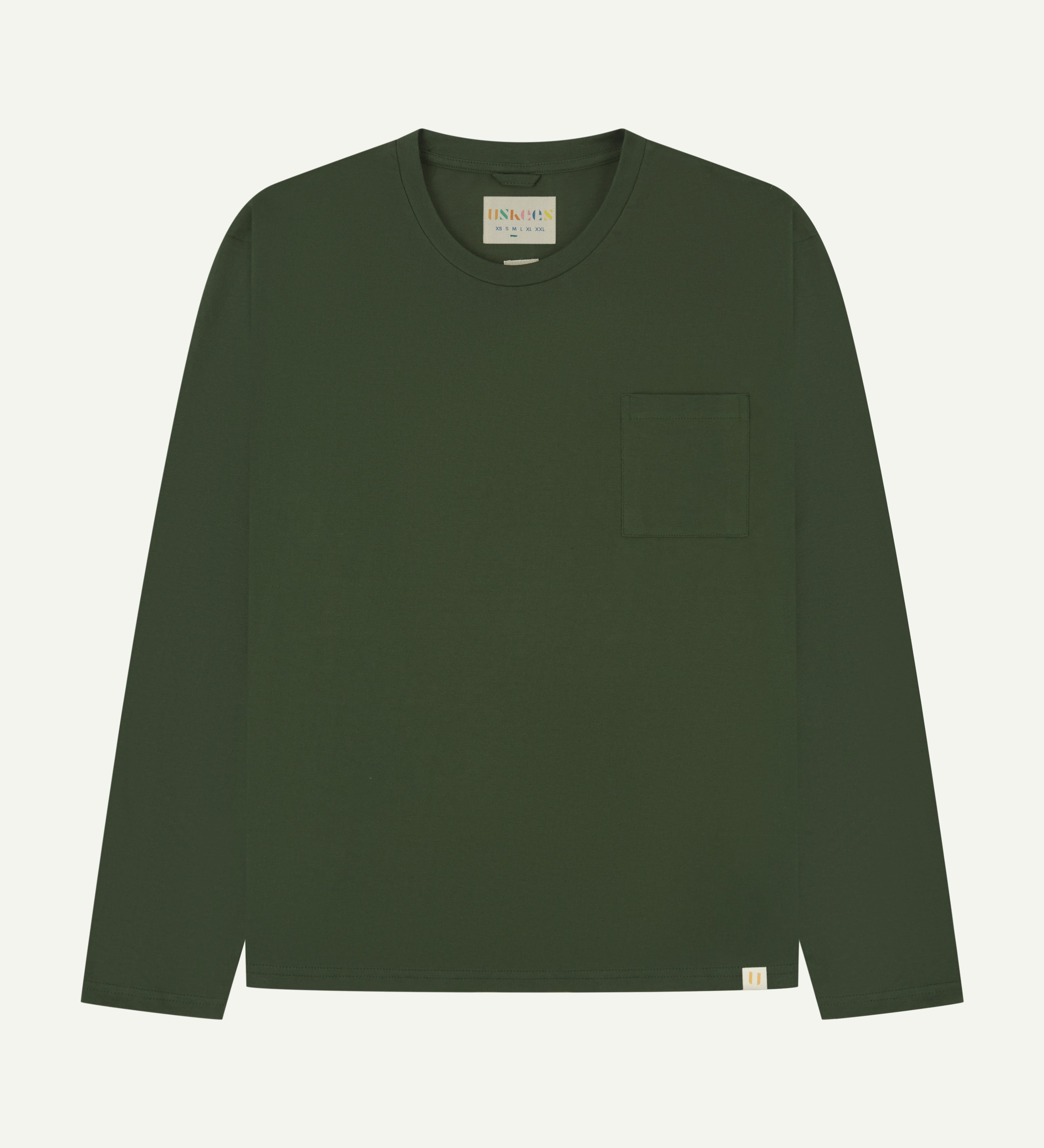 Front flat shot of long sleeve Uskees t-shirt in coriander green showing breast pocket and discreet Uskees branding at hem