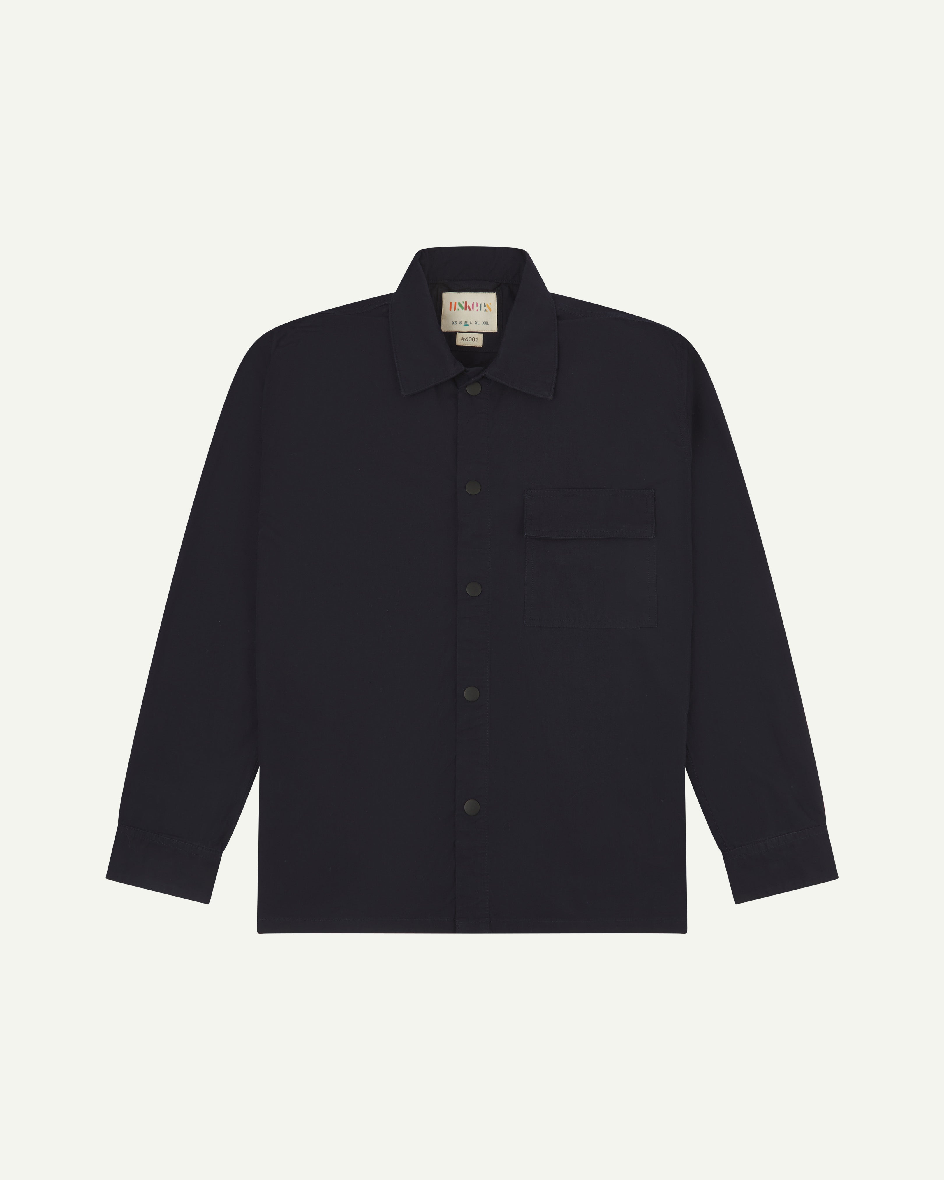 front flat shot of dark blue uskees lightweight shirt with popper front fastening