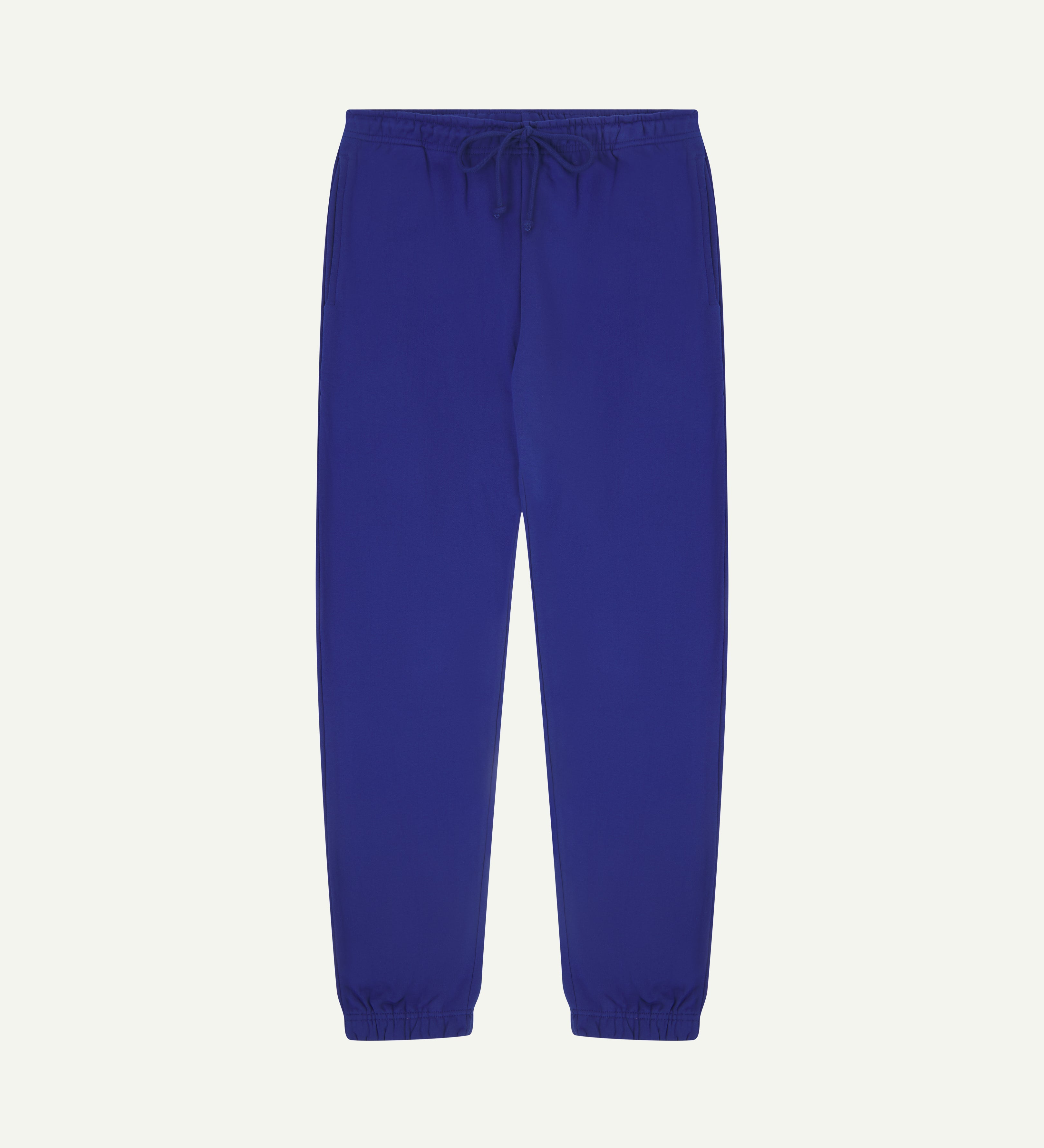 Front view of bright blue organic cotton Jogging Pants for men by Uskees.