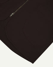 Close up shot of Uskees #3036 dark plum zip front vest showing curved pocket detail