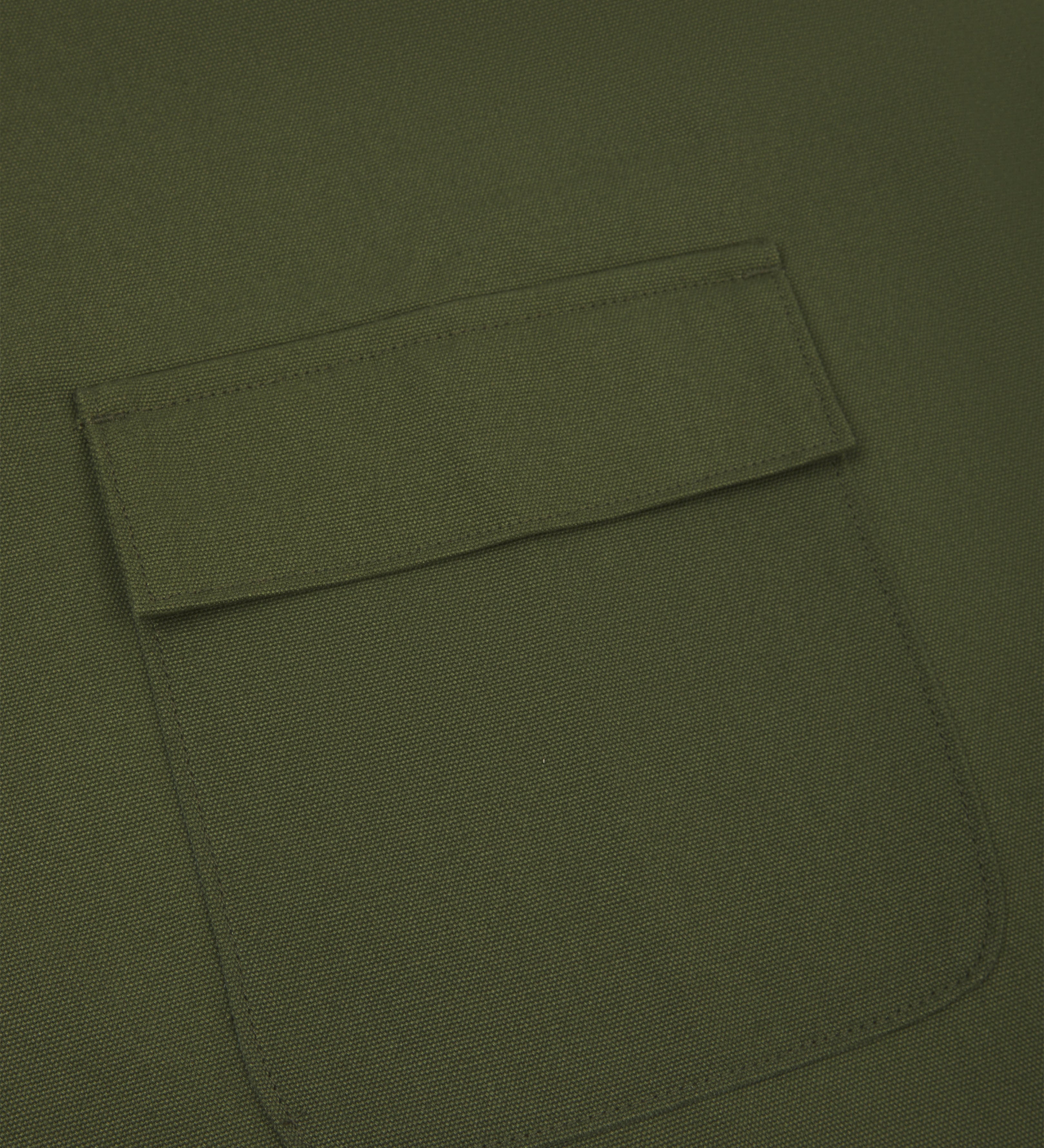 Close up shot of uskees green canvas apron showing front flap pocket
