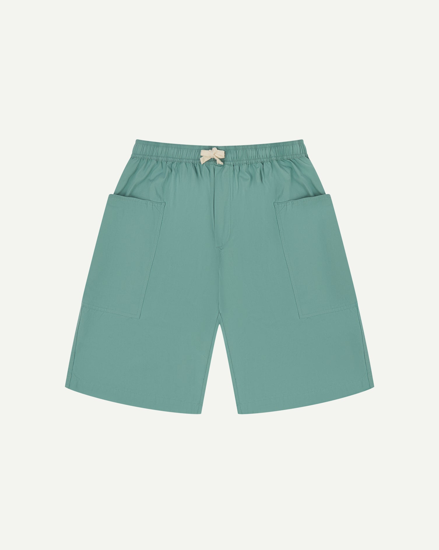 Front view of eucalyptus green organic cotton #5015 lightweight cotton shorts by Uskees. Clear view of elasticated waist and deep front pockets.