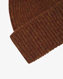 Close-up shot of uskees chestnut brown knitted beanie on a white background