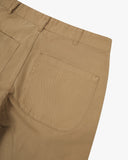 Close up view of view of 5016 Uskees men's cotton twill khaki 'commuter' trousers showing the back pocket detail