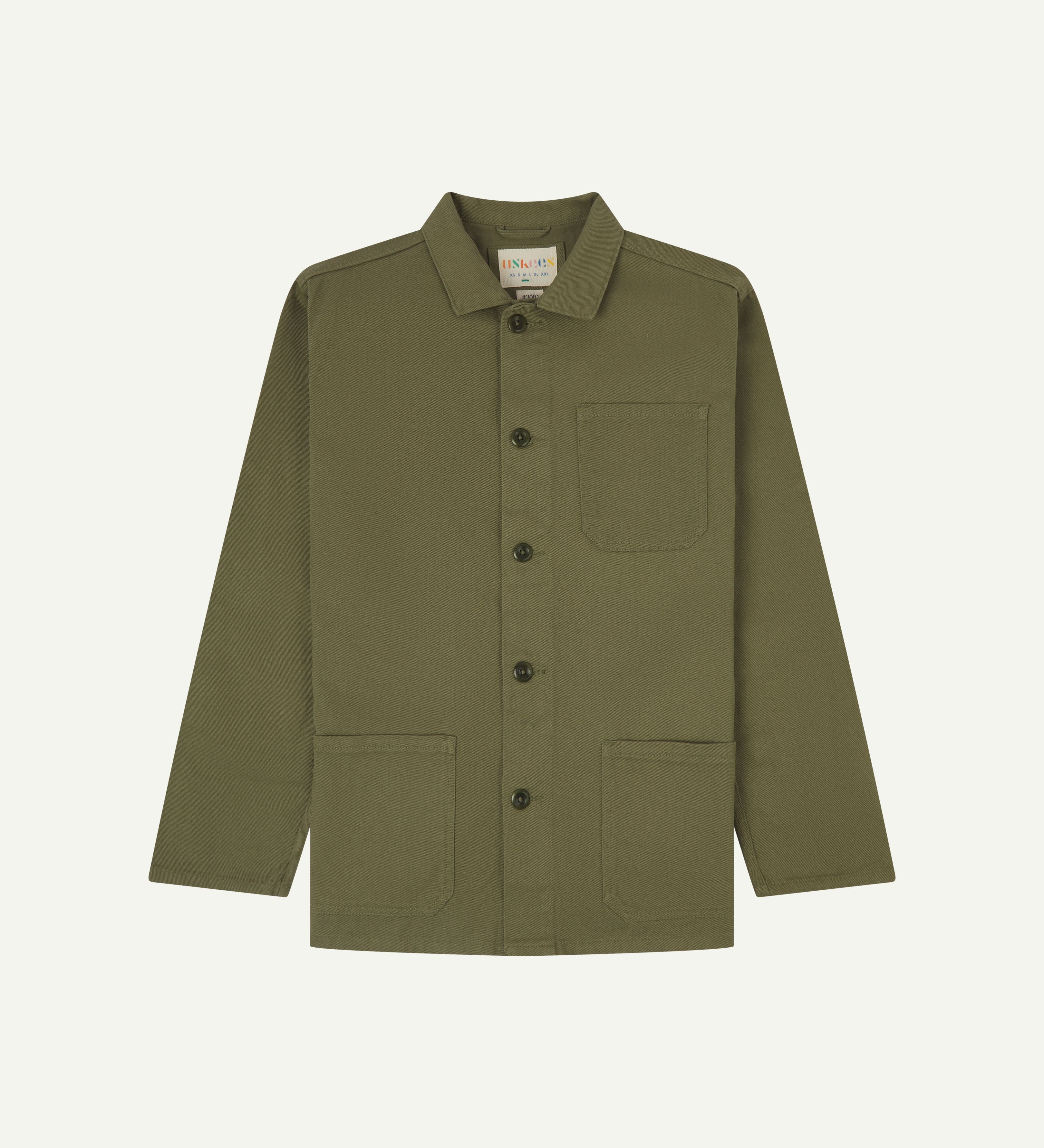 Front flat shot of moss-green buttoned organic cotton-drill overshirt from Uskees. Clear view of deep pockets on the chest and front and Uskees branding label.
