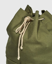 Closer view of the cream organic cotton drawstring on the moss green Uskees #0402 bucket bag.