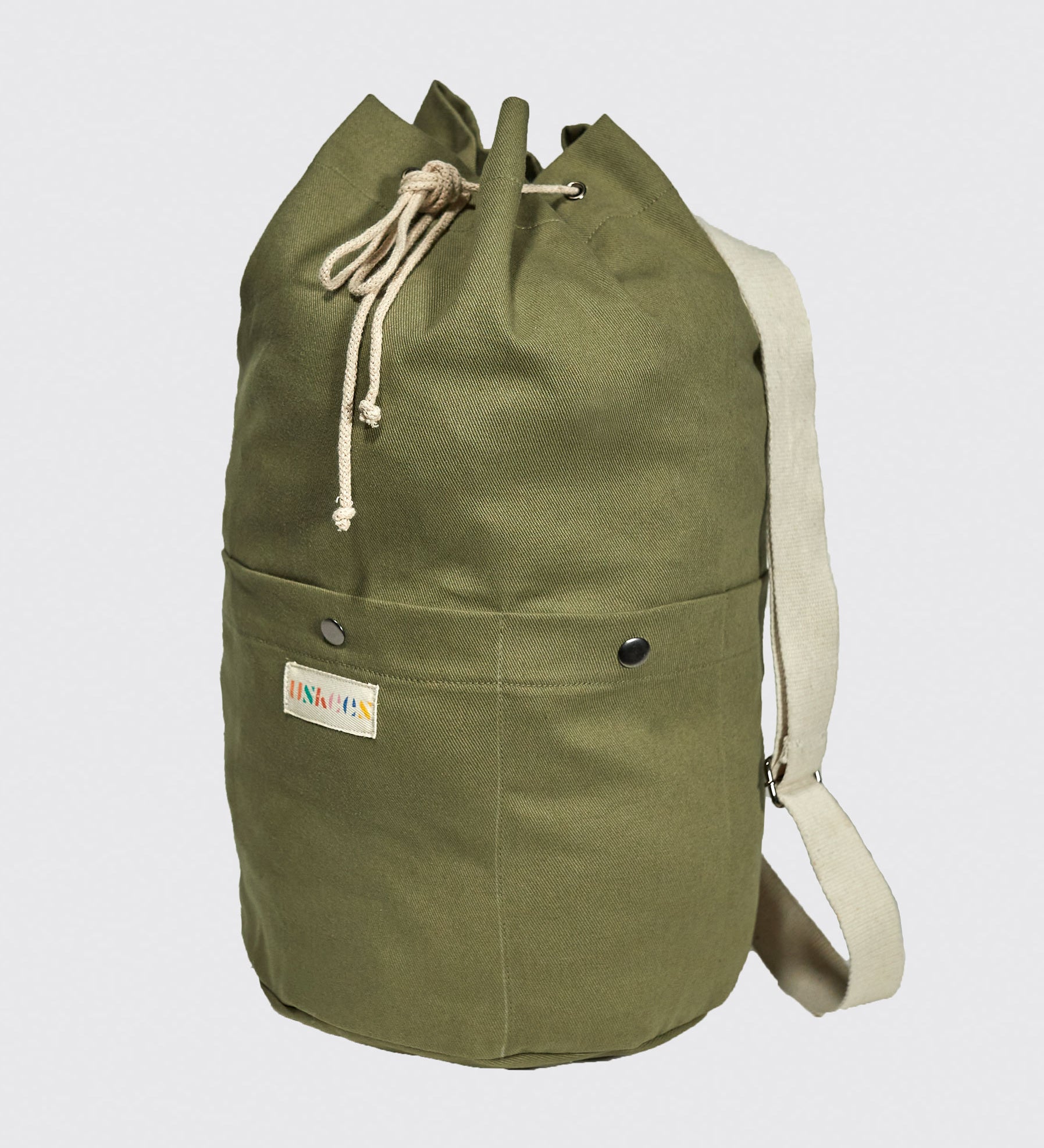 Full-length upright view of Uskees #0402 bucket bag, clearly showing the drawstring top, cylindrical shape and marsh green canvas.