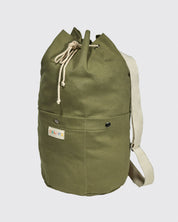 Full-length upright view of Uskees #0402 bucket bag, clearly showing the drawstring top, cylindrical shape and marsh green canvas.