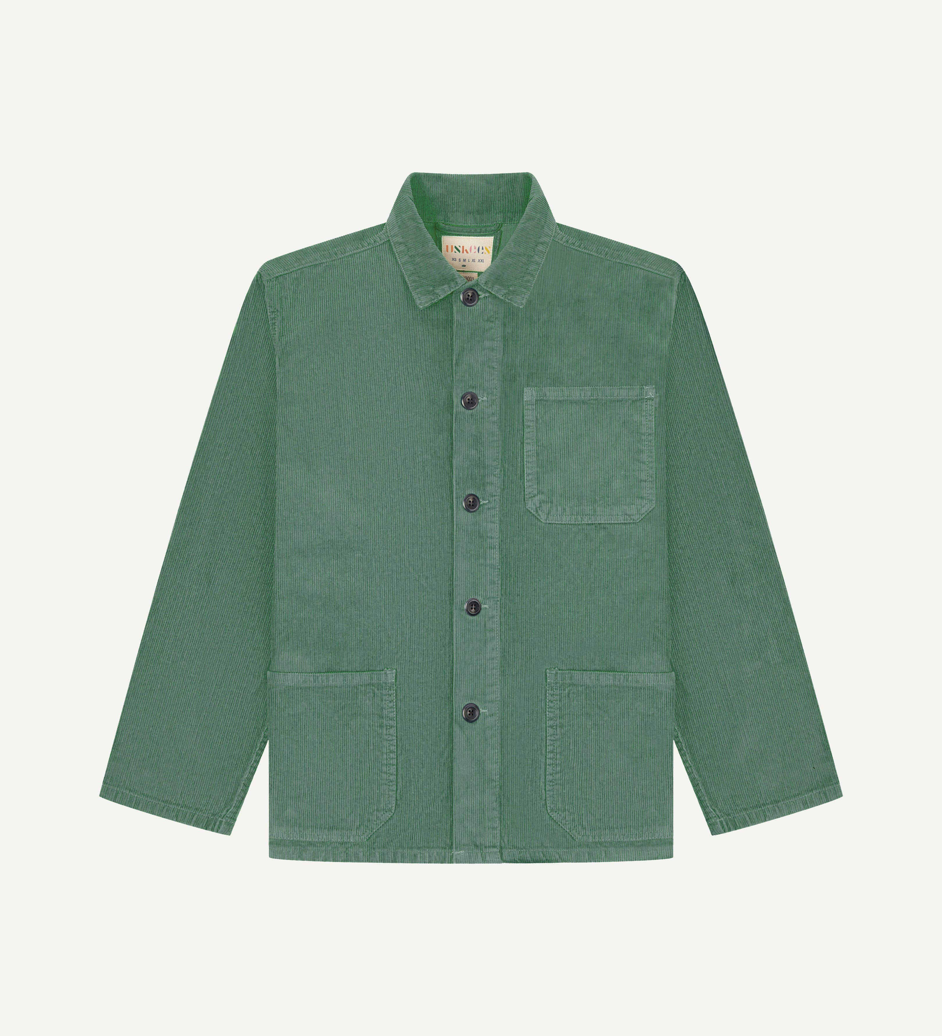 Front flat shot of light green, buttoned corduroy overshirt from Uskees. Clear view of cream corozo buttons, chest and hip pockets.