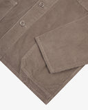 View of the hem, sleeve and hip pocket of the 3001 Uskees button-down corduroy overshirt in beech (pale brown).