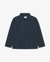 Front flat shot of blueberry, buttoned ripstop overshirt. Clear view of chest and hip pockets, corozo buttons and Uskees branding label.