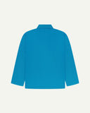Back view of bright blue, buttoned organic cotton overshirt with view of reinforced elbow area and boxy silhouette.