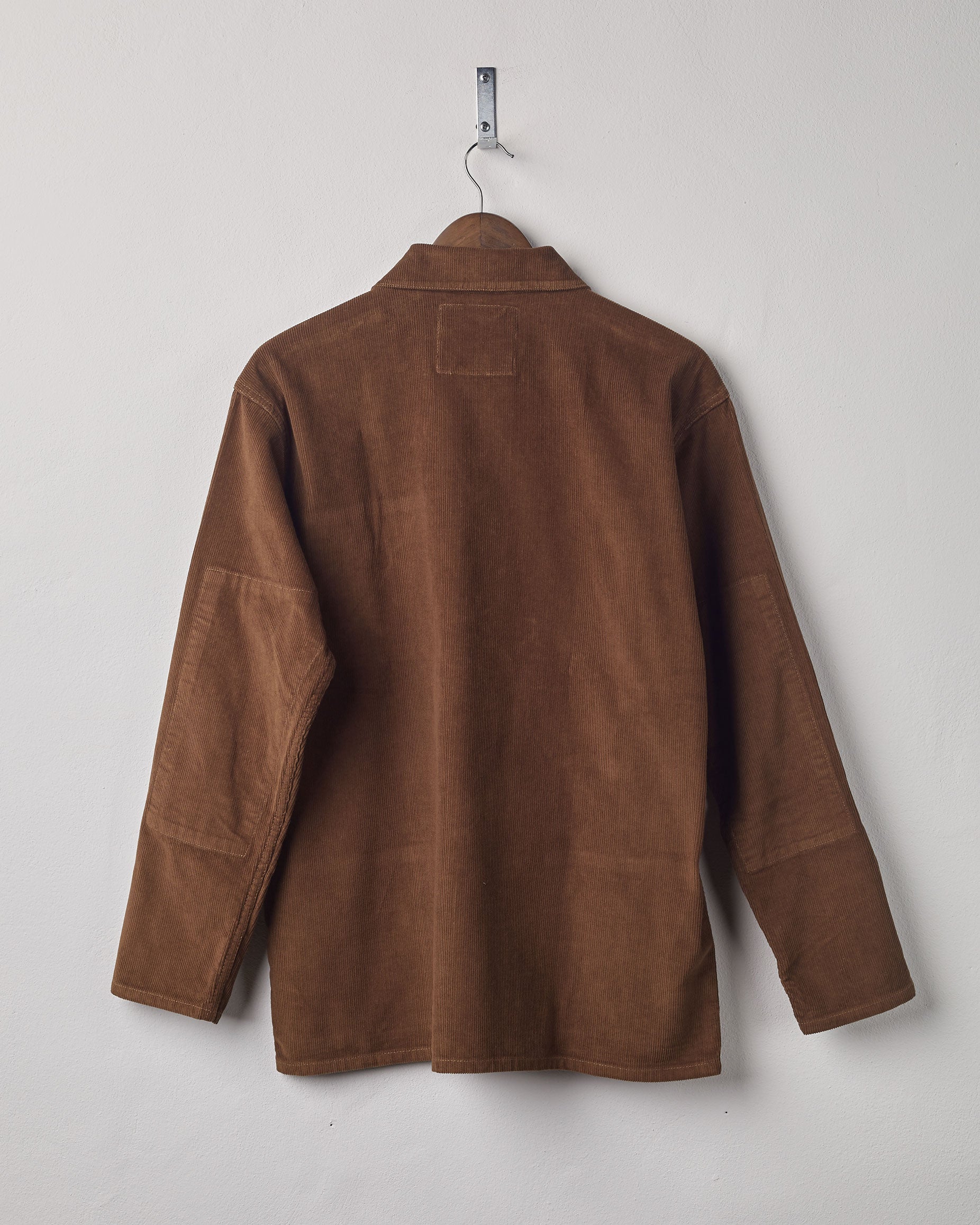Full-length rear view of #3001, brown-coloured corduroy over shirt with reinforced elbows.