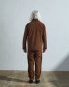 Full-length rear view of model wearing #3001, 'brown' corduroy over shirt with reinforced elbows.