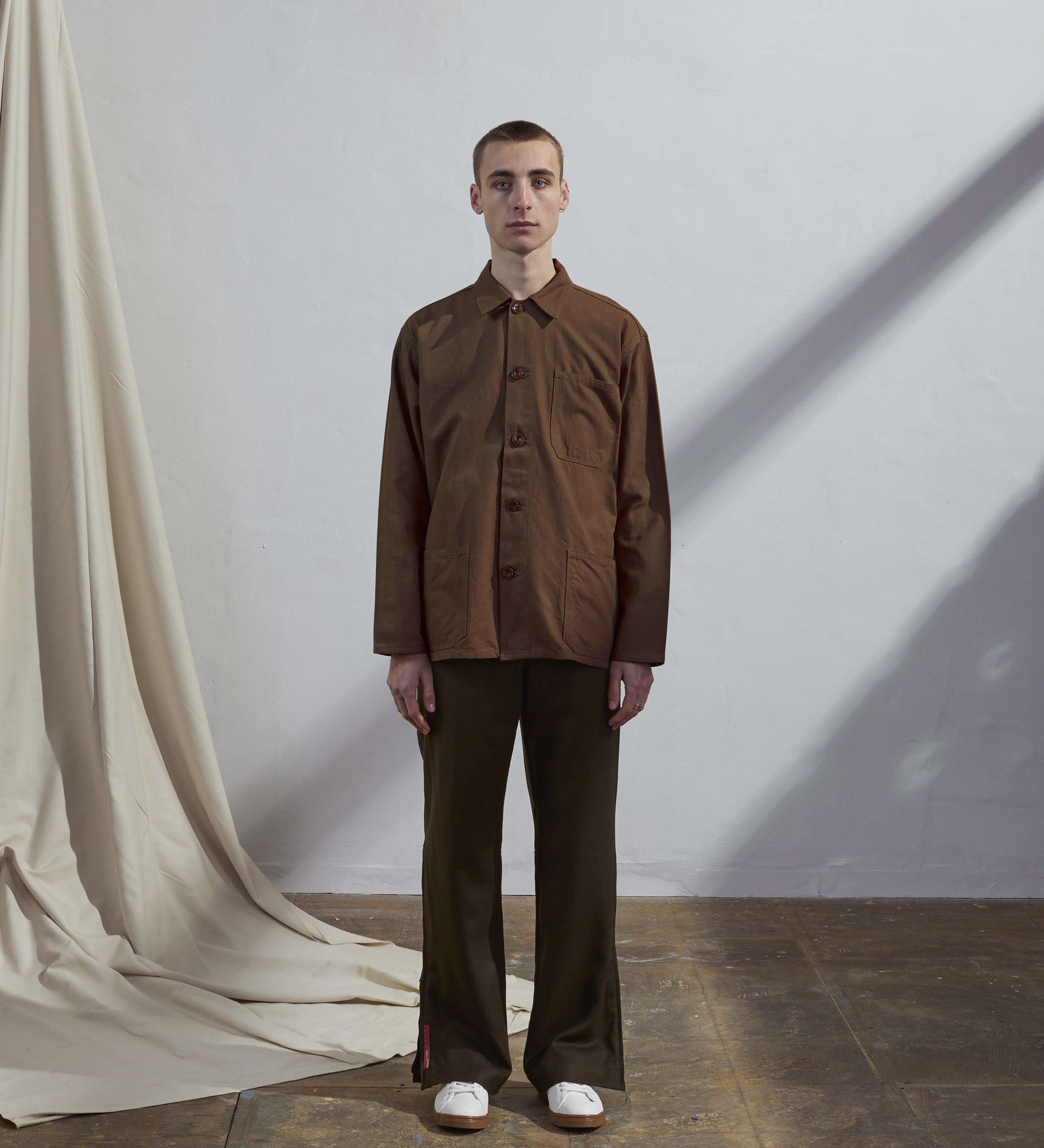 Full-length front view of model wearing #3001, brown over shirt.