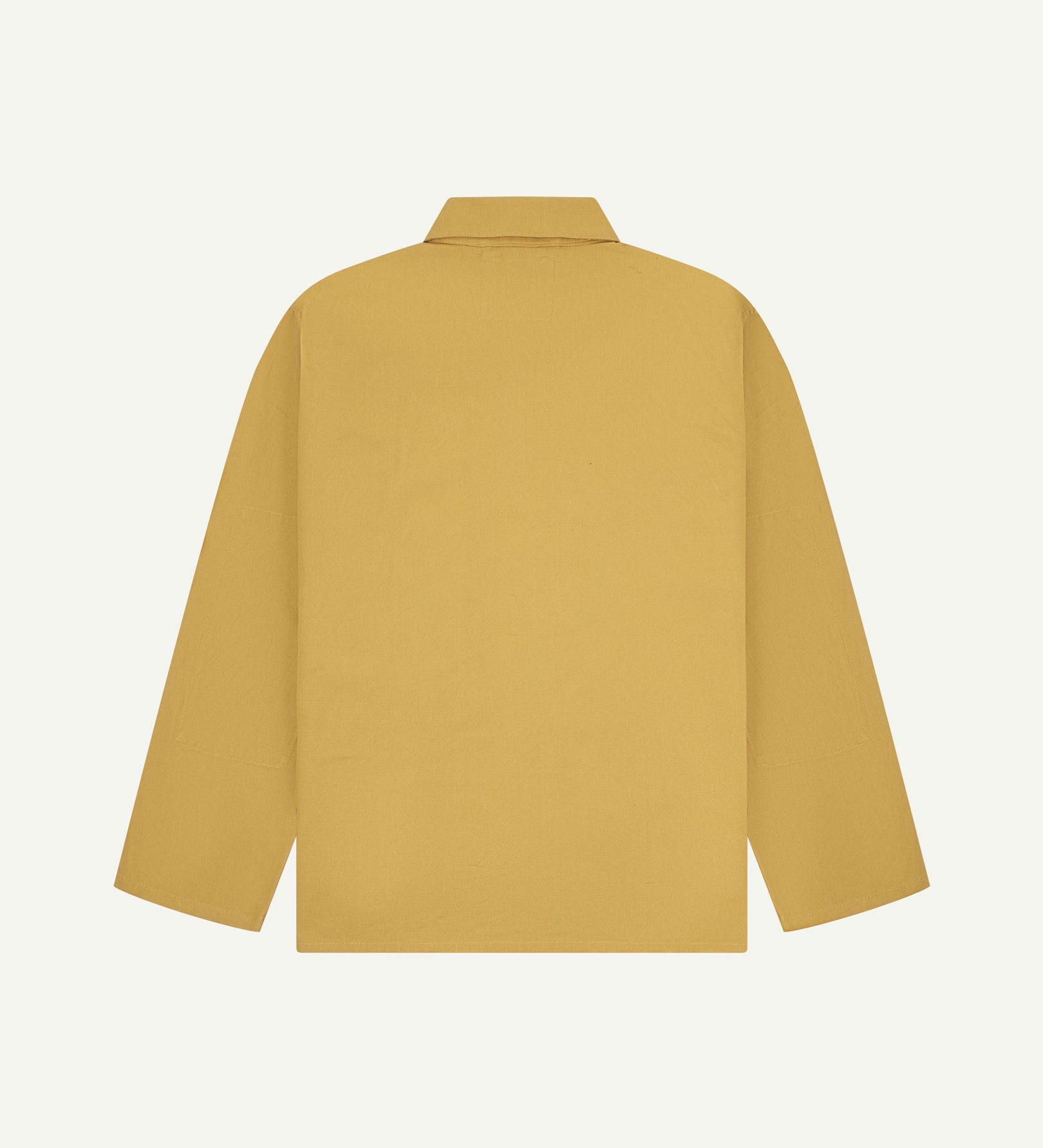 Back view of yellow (citronella), buttoned organic cotton overshirt with view of reinforced elbow area and boxy silhouette.