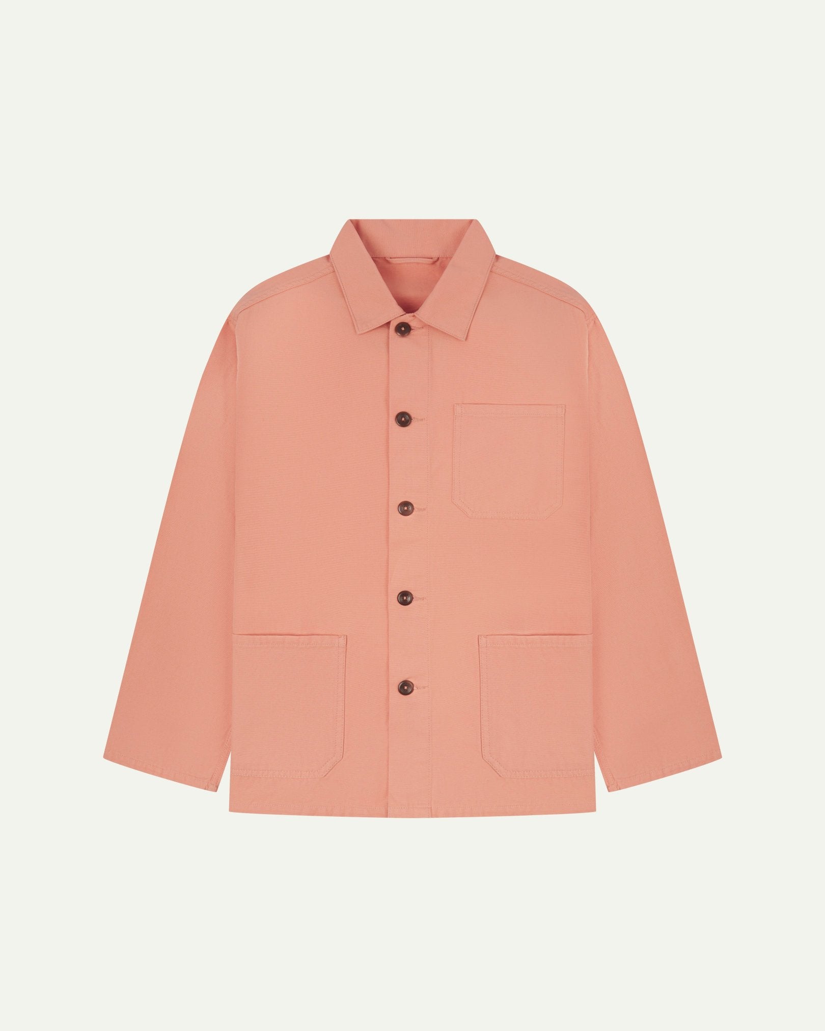 Front flat shot of pink-orange (coral), buttoned organic cotton overshirt. Clear view of chest and hip pockets, corozo buttons and simple, boxy shape.