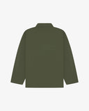 Back view of coriander-green, buttoned organic cotton overshirt with view of reinforced elbow area and boxy silhouette.