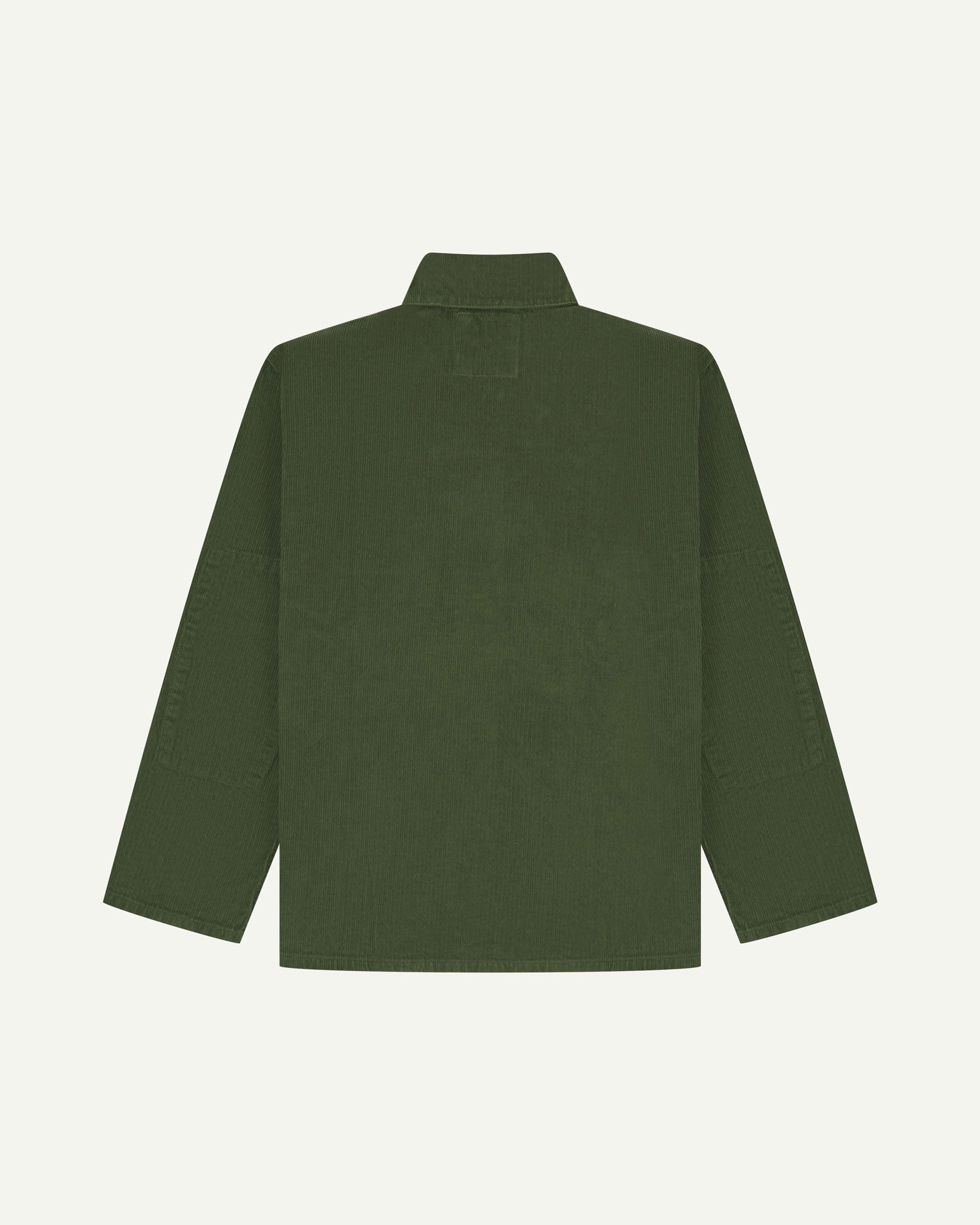 Back view of coriander-green, buttoned corduroy overshirt with view of reinforced elbow area and boxy silhouette.