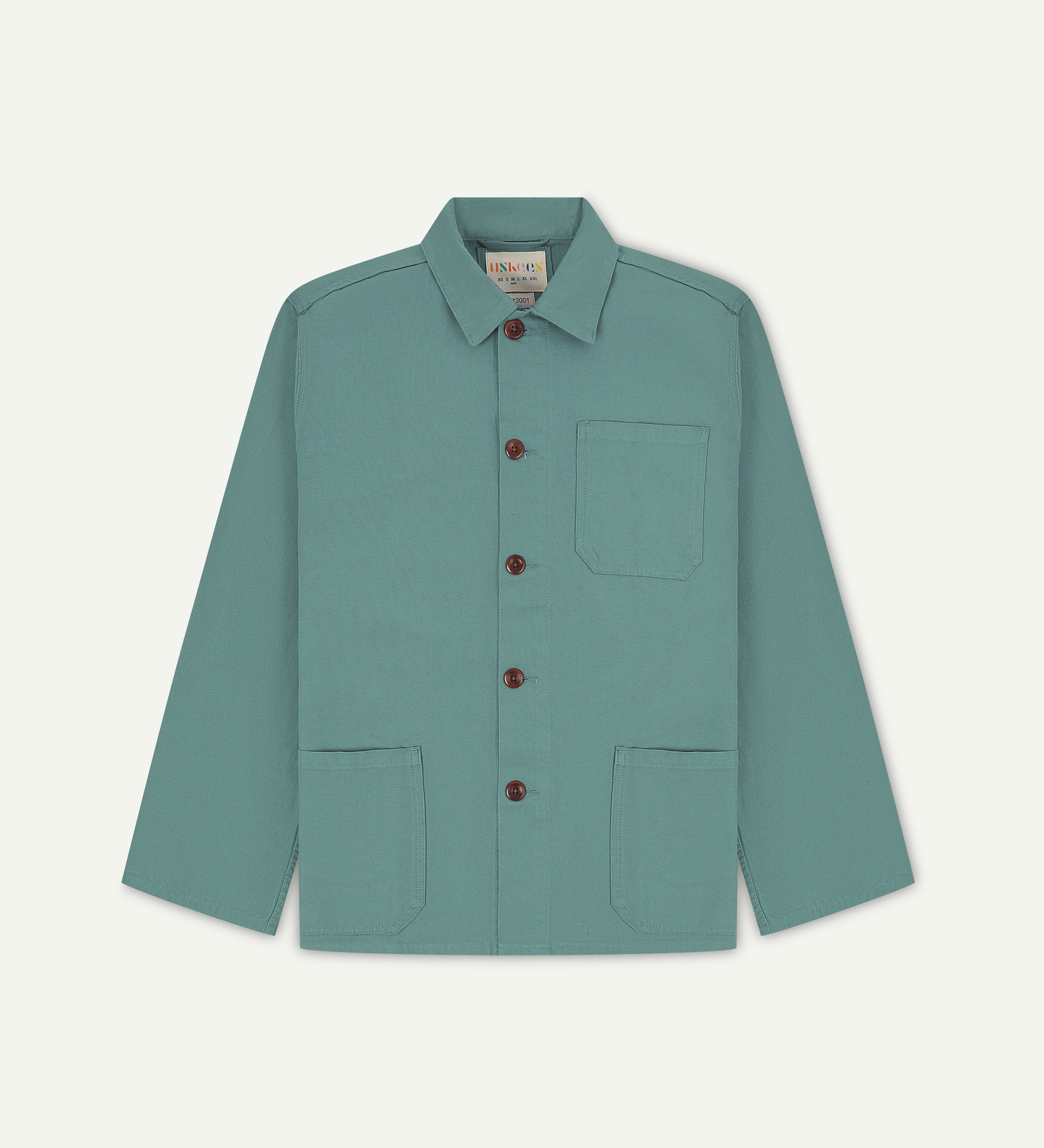 Flat shot of the front of eucalyptus green men's overshirt with buttons done up and showing uskees neck label