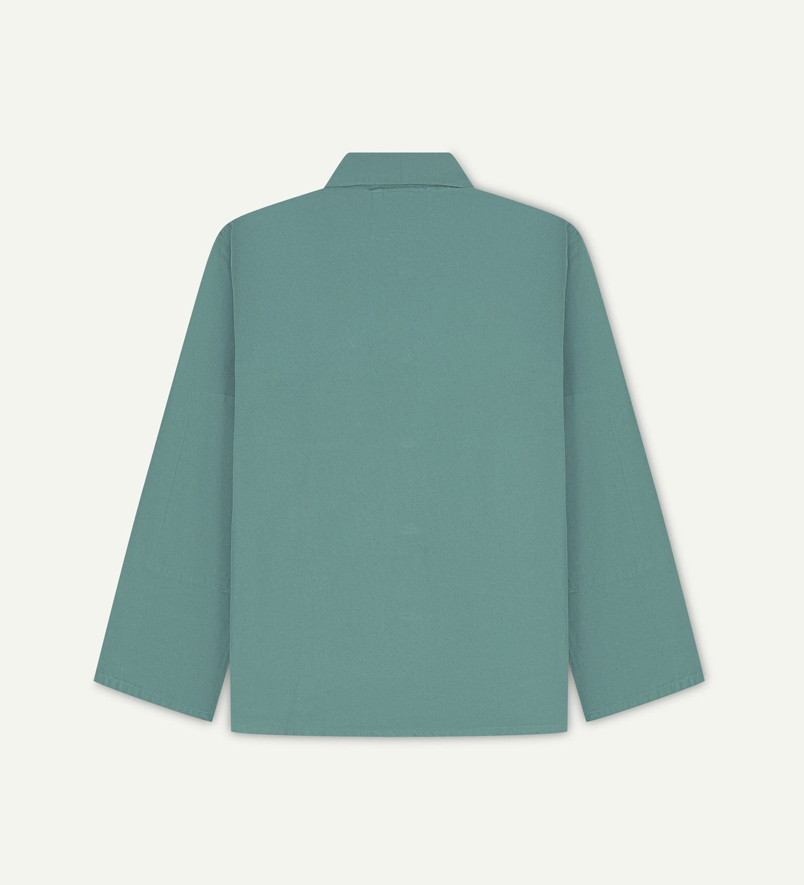 Back view of blue-green (eucalyptus), buttoned organic cotton overshirt with view of reinforced elbow area and boxy silhouette.