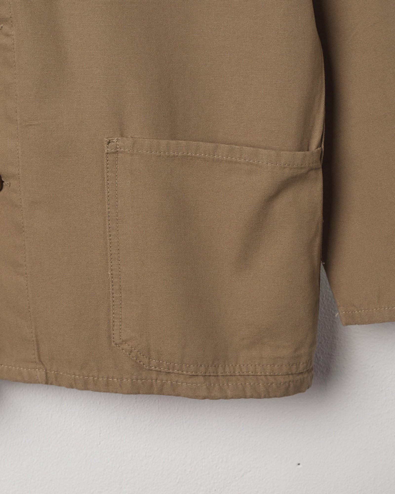 View of the deep hip pocket on the the 3001 Uskees button-down khaki overshirt .