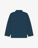 Reverse of maya blue buttoned organic cotton organic cotton overshirt from Uskees. Showing reinforced elbows and boxy silhouette.