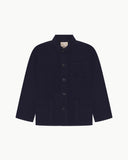 Front flat shot of midnight blue, buttoned corduroy overshirt. Clear view of chest and hip pockets, corozo buttons and Uskees branding label.