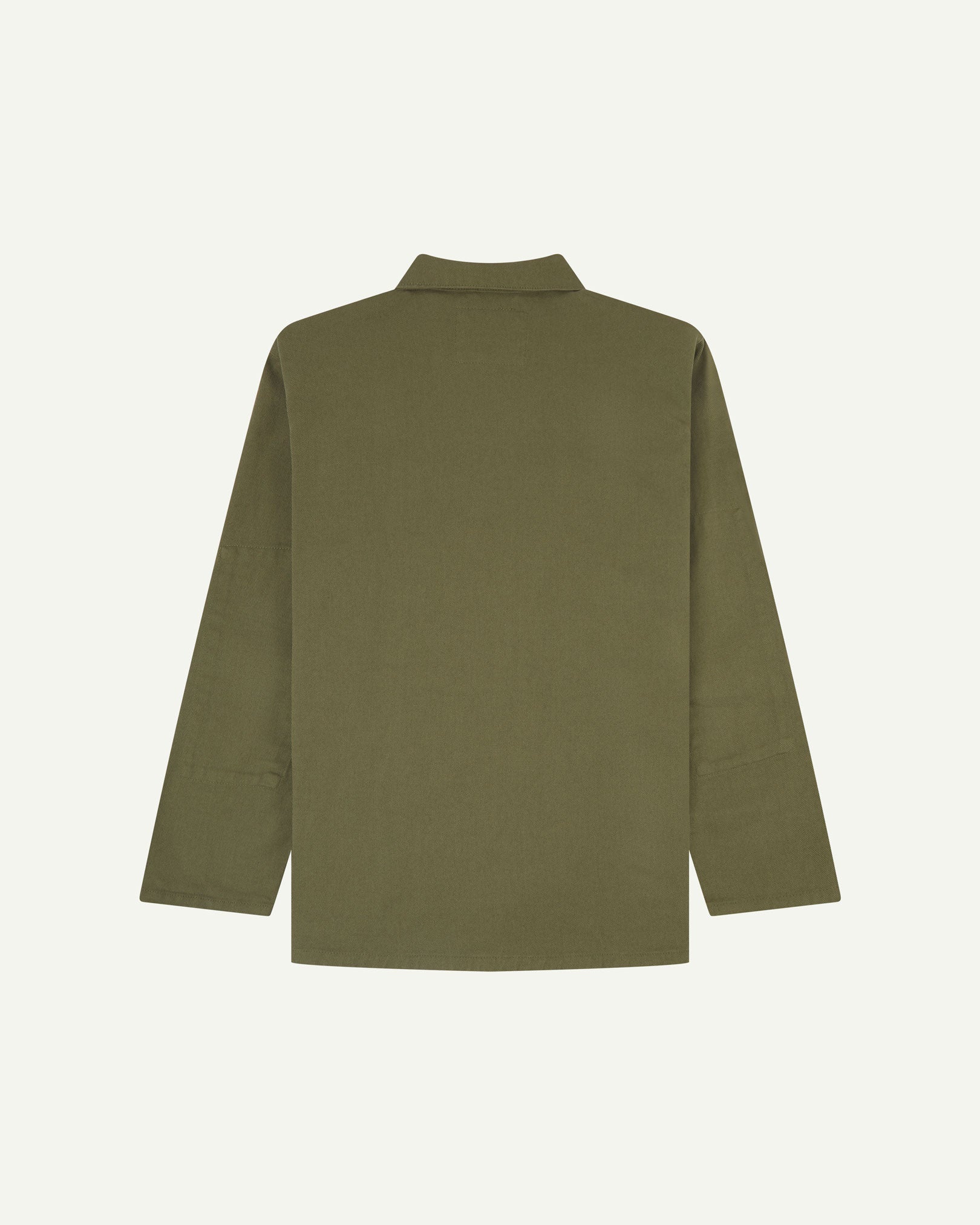 Reverse of moss-green buttoned organic cotton drill overshirt from Uskees. Showing reinforced elbows and boxy silhouette.