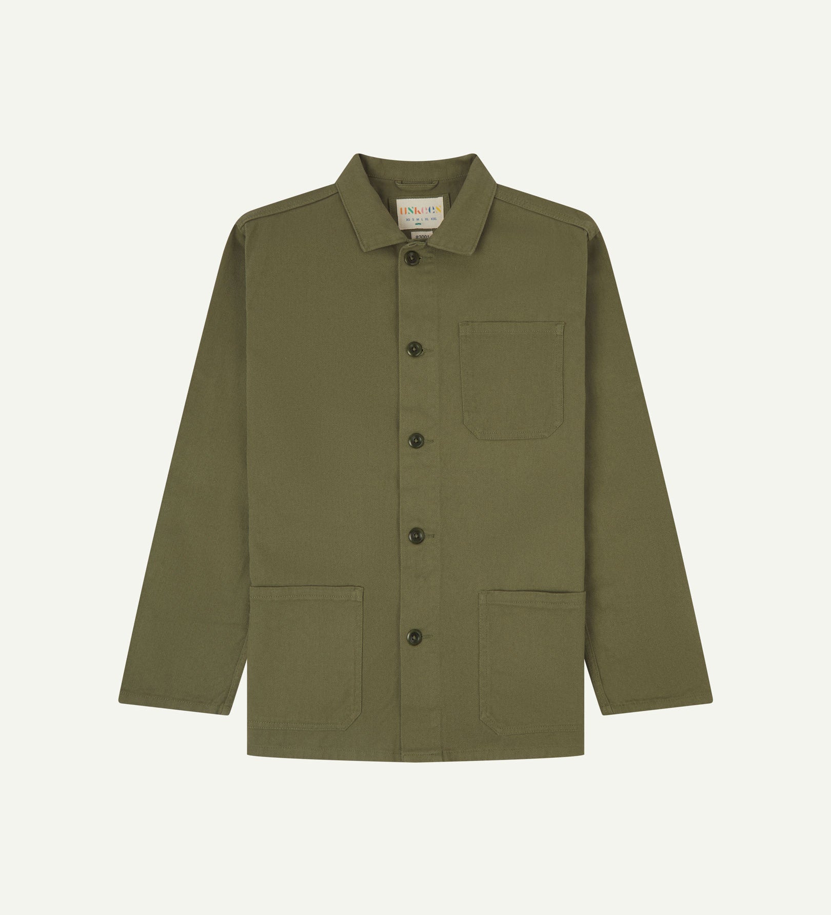 Front flat shot of moss-green, buttoned drill overshirt. Clear view of corozo buttons, 3 pockets and Uskees branding label.