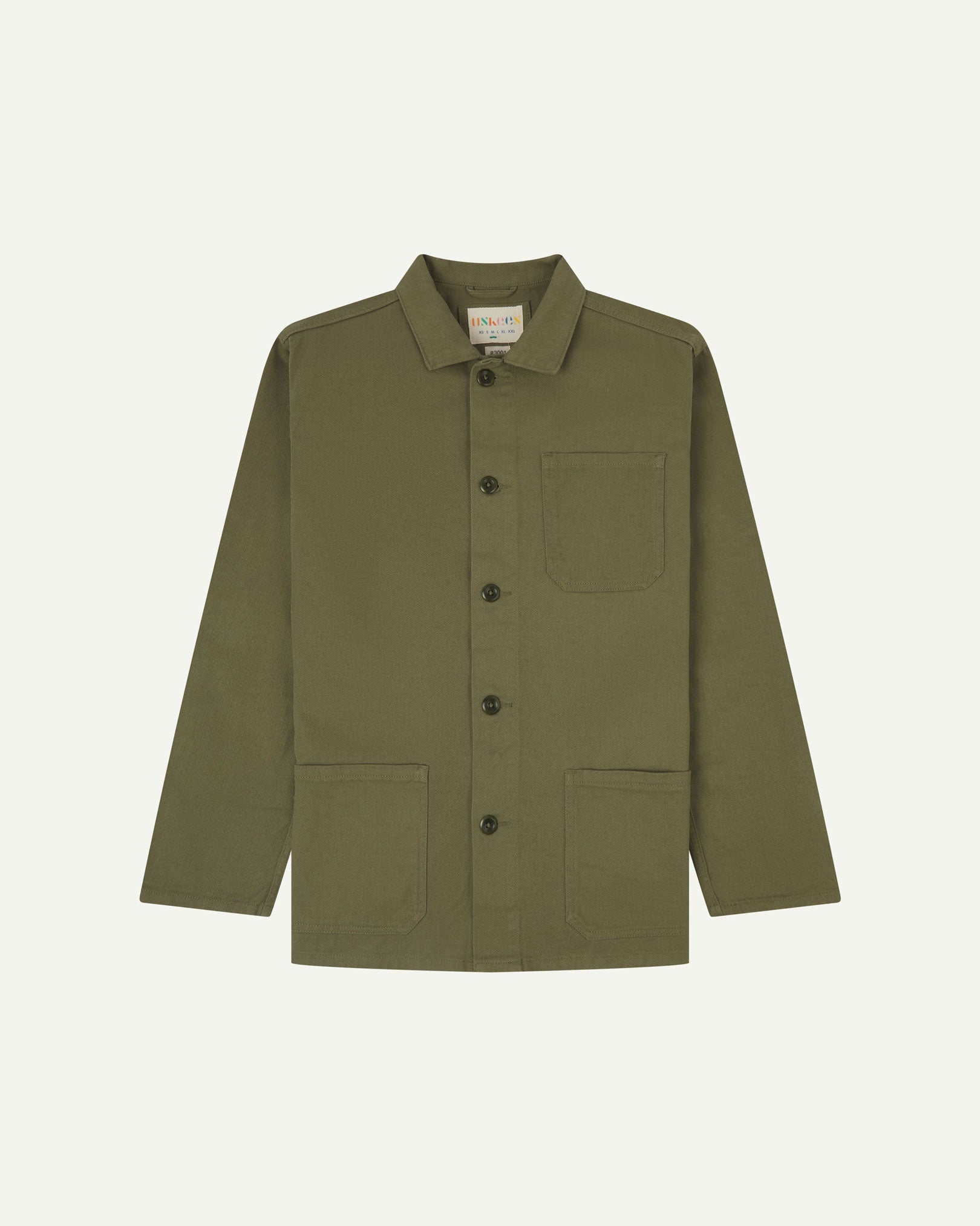 Front flat shot of moss-green, buttoned drill overshirt. Clear view of corozo buttons, 3 pockets and Uskees branding label.