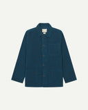 Front flat shot of petrol blue, buttoned corduroy overshirt. Clear view of chest and hip pockets, corozo buttons and Uskees branding label.