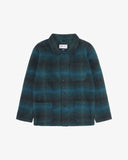 Front flat shot of peacock blue check, buttoned Pennine wool overshirt. Clear view of chest and hip pockets, corozo buttons and Uskees branding label.